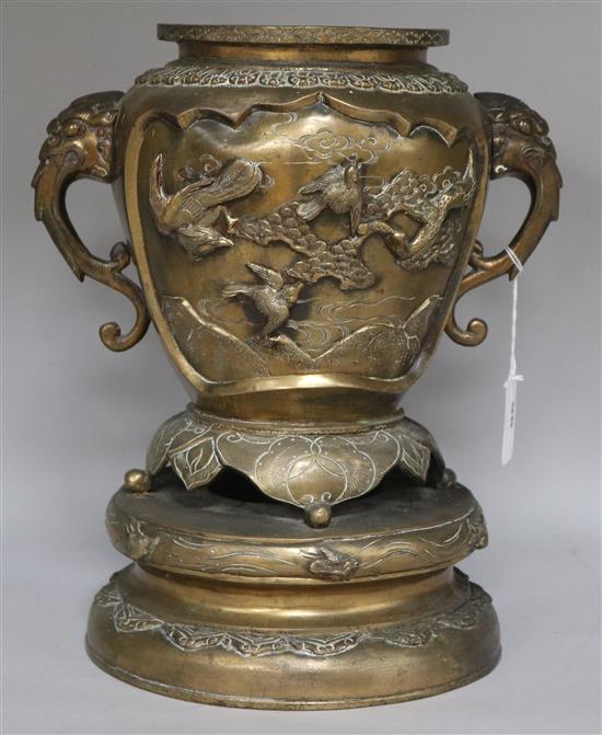 A Chinese bronze vase with elephant head handles